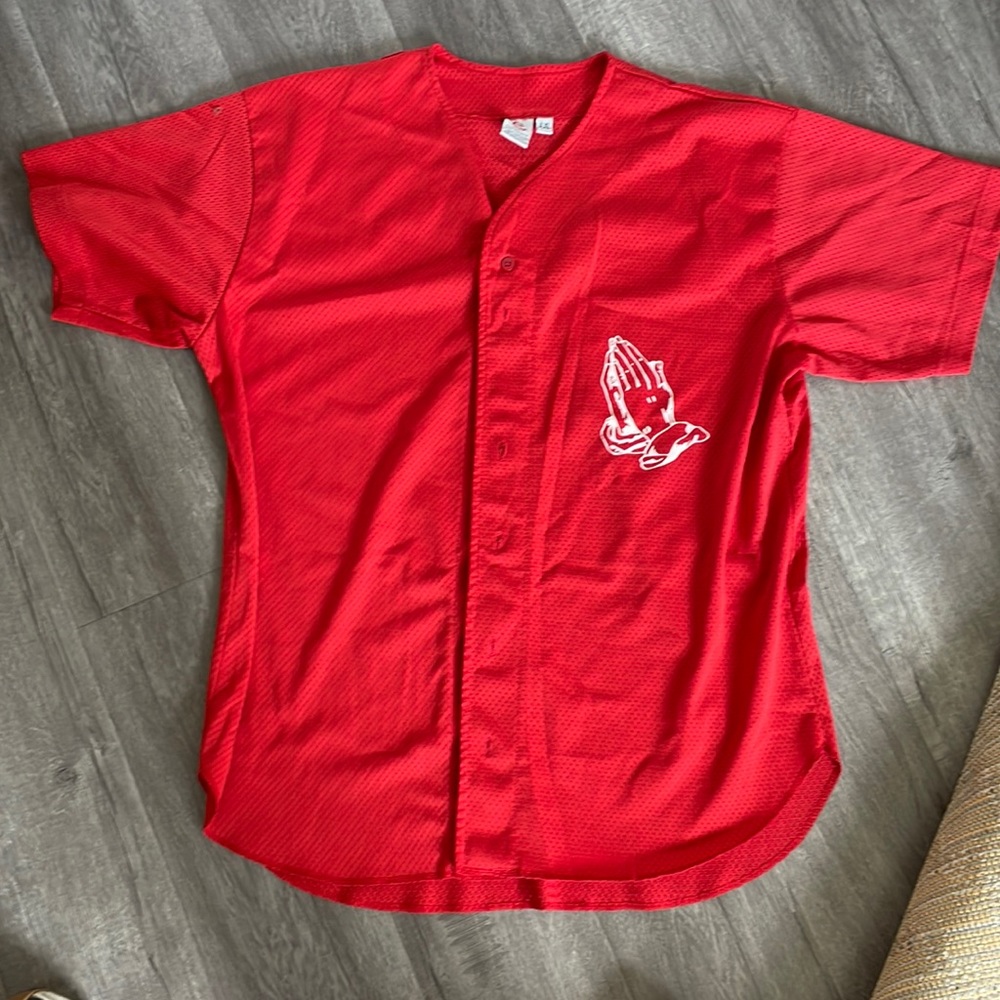 Folded hands baseball tee.